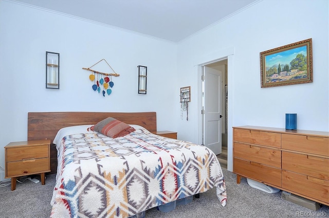 bedroom featuring crown molding and carpet floors