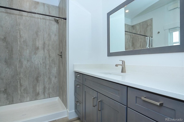 bathroom with a shower with shower curtain and vanity