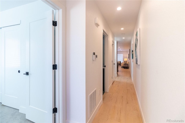 hallway featuring light wood-type flooring