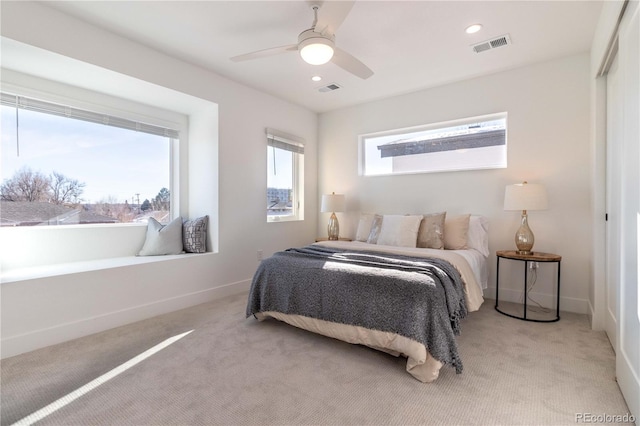 carpeted bedroom with ceiling fan