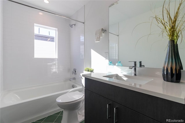 full bathroom with tiled shower / bath combo, vanity, and toilet