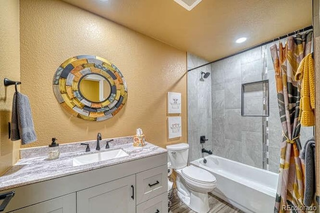 336 Arrowhead Dr, Florence, CO 81226 - full bath featuring a textured wall, vanity, shower / bathtub combination with curtain, and wood finished floors