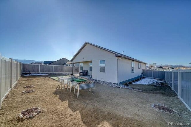 336 Arrowhead Dr, Florence, CO 81226 - rear view of house with a fenced backyard