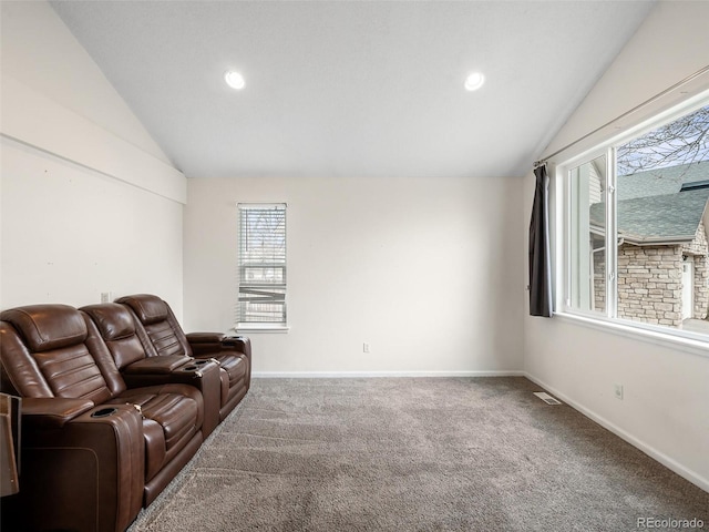 living room with lofted ceiling, baseboards, visible vents, and carpet flooring