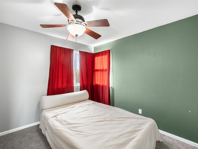 bedroom featuring carpet floors, baseboards, and a ceiling fan