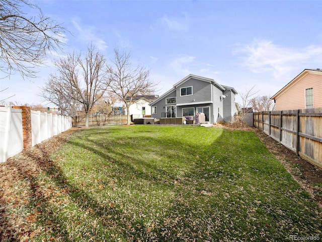 view of yard with a fenced backyard