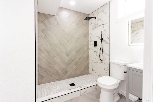 1617 S Quitman St, Denver, CO 80219 - full bathroom featuring vanity, toilet, tiled shower, and recessed lighting