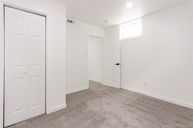 1617 S Quitman St, Denver, CO 80219 - unfurnished bedroom with carpet floors, baseboards, and a closet