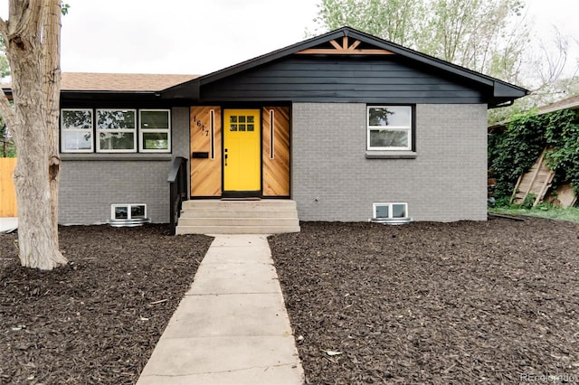 1617 S Quitman St, Denver, CO 80219 - view of front facade with brick siding