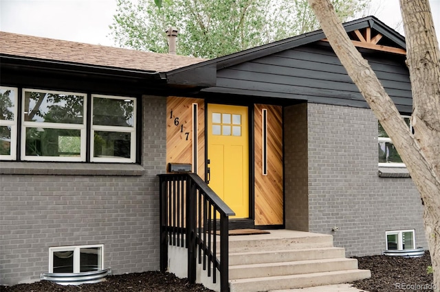1617 S Quitman St, Denver, CO 80219 - property entrance with brick siding