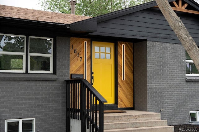 1617 S Quitman St, Denver, CO 80219 - doorway to property with brick siding