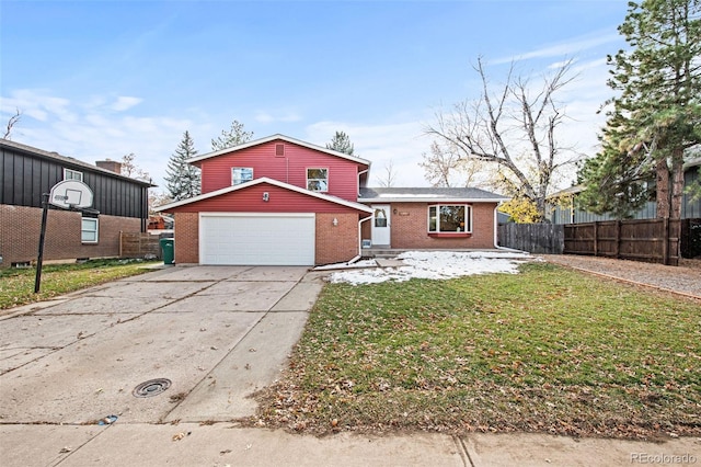 view of front of house featuring a front yard and a garage