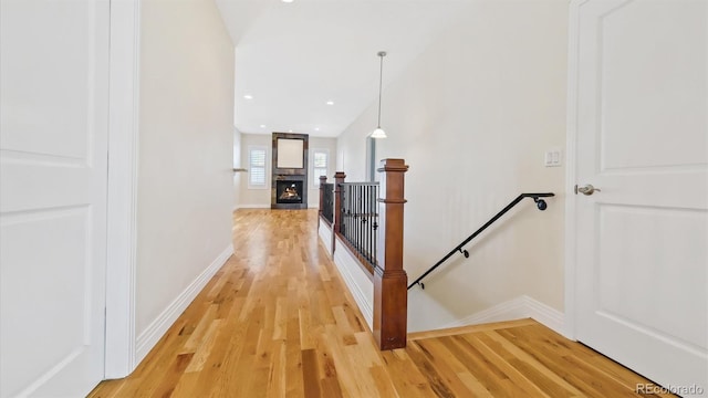 hallway with light hardwood / wood-style flooring