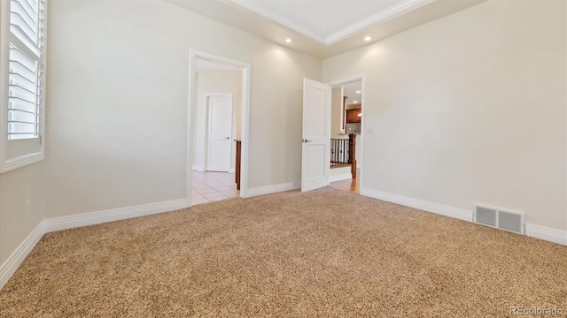 carpeted empty room featuring a wealth of natural light