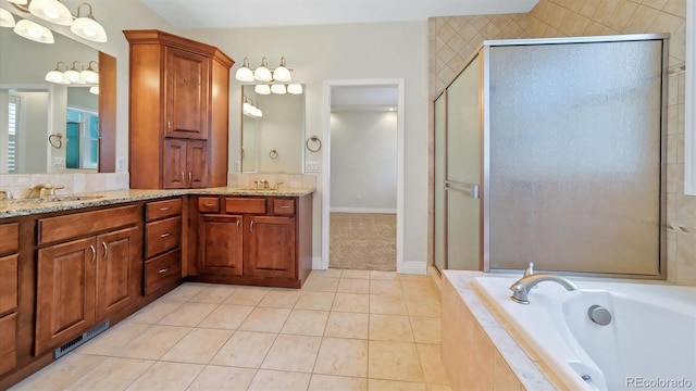 bathroom featuring shower with separate bathtub, tile patterned floors, and vanity