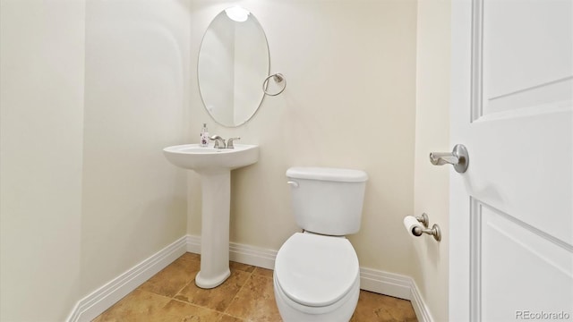 bathroom featuring tile patterned floors and toilet