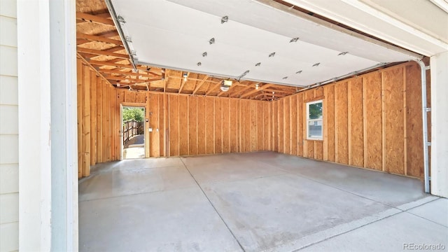 garage featuring wooden walls