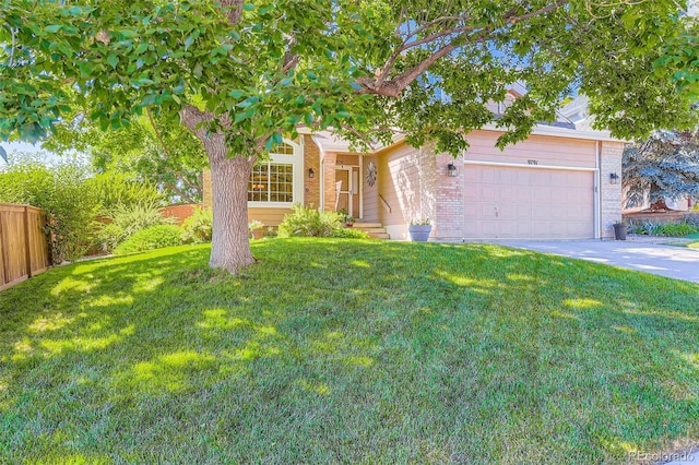 9791 Sterling Dr, Highlands Ranch, CO 80126 - obstructed view of property with brick siding, an attached garage, and concrete driveway