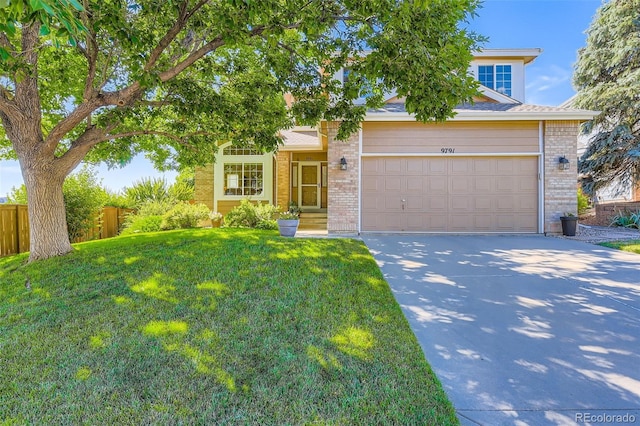 9791 Sterling Dr, Highlands Ranch, CO 80126 - obstructed view of property featuring brick siding, driveway, and a garage