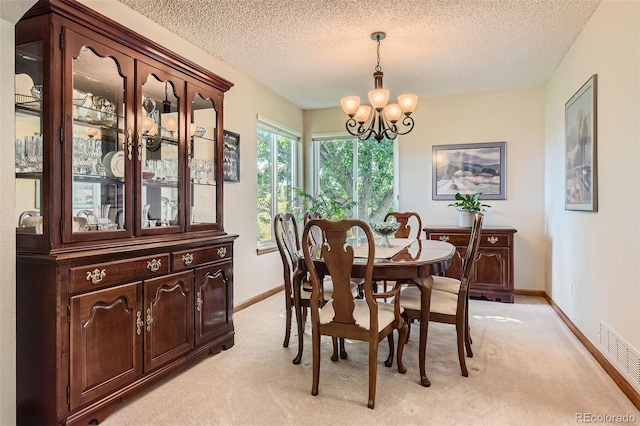 9791 Sterling Dr, Highlands Ranch, CO 80126 - dining area with a chandelier, light carpet, and a textured ceiling