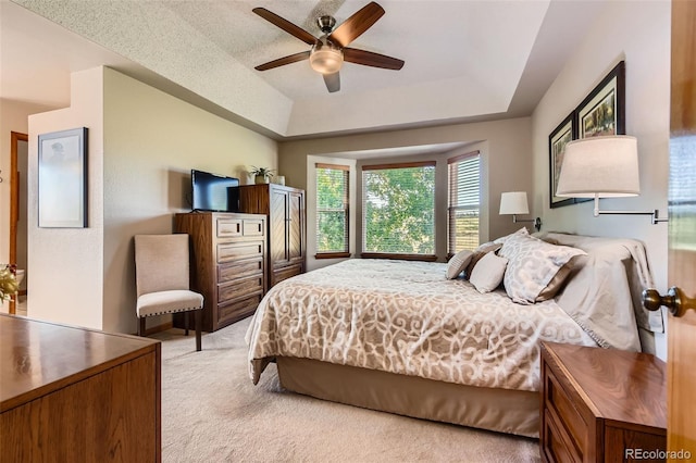 9791 Sterling Dr, Highlands Ranch, CO 80126 - bedroom featuring a raised ceiling, light carpet, and a ceiling fan