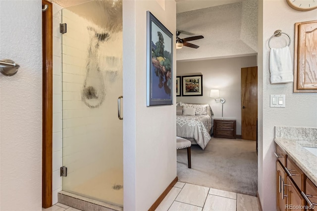 9791 Sterling Dr, Highlands Ranch, CO 80126 - full bath with a textured ceiling, a shower stall, vanity, a ceiling fan, and ensuite bath