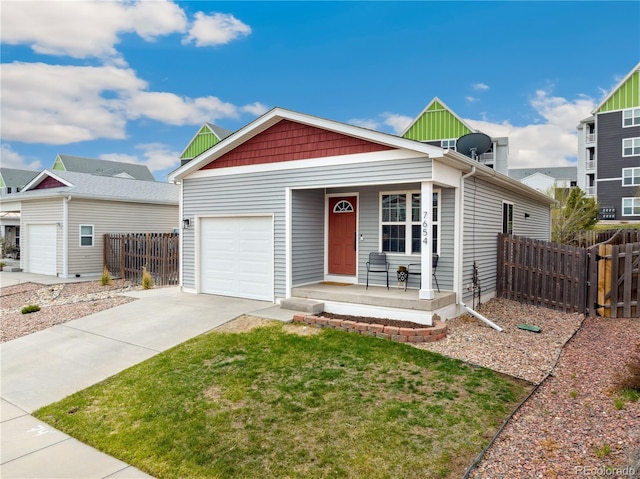 7654 Crestone Peak Trl, Colorado Springs, CO 80924 - view of front facade featuring a porch, driveway, and a garage