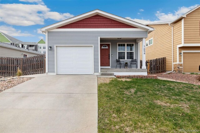 7654 Crestone Peak Trl, Colorado Springs, CO 80924 - view of front facade with a porch, driveway, and a garage