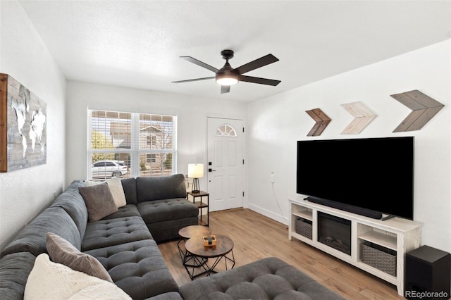 7654 Crestone Peak Trl, Colorado Springs, CO 80924 - living room featuring a ceiling fan, wood finished floors, and baseboards