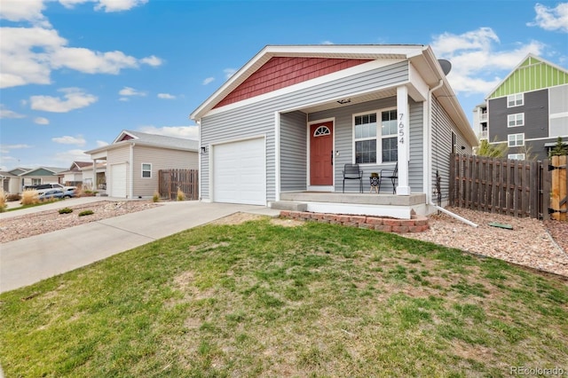 7654 Crestone Peak Trl, Colorado Springs, CO 80924 - view of front of property featuring covered porch, a garage, and concrete driveway