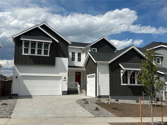 16521 Black Rose Cir, Parker, CO 80134 - view of front facade with board and batten siding, driveway, an attached garage, and a shingled roof