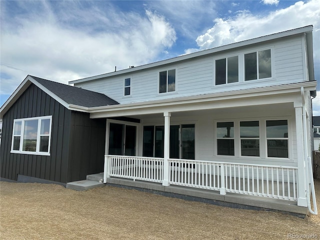 16521 Black Rose Cir, Parker, CO 80134 - back of house with covered porch and board and batten siding