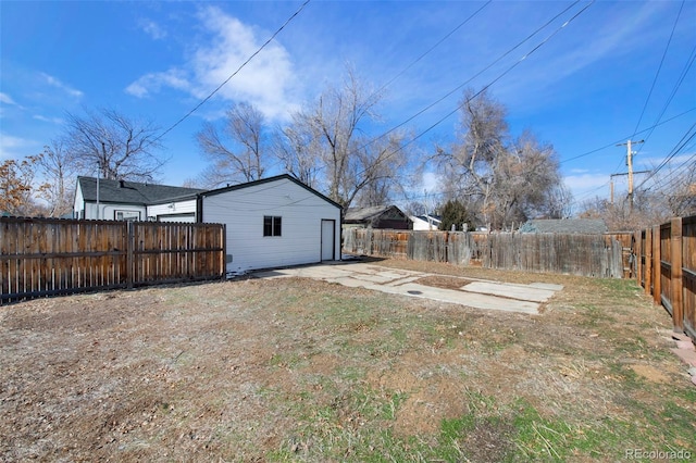 view of yard with a fenced backyard and a patio