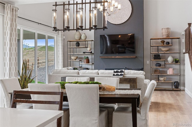 dining space featuring an inviting chandelier and wood-type flooring