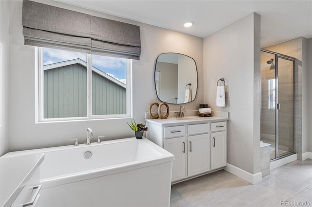 bathroom with vanity, tile patterned floors, and independent shower and bath