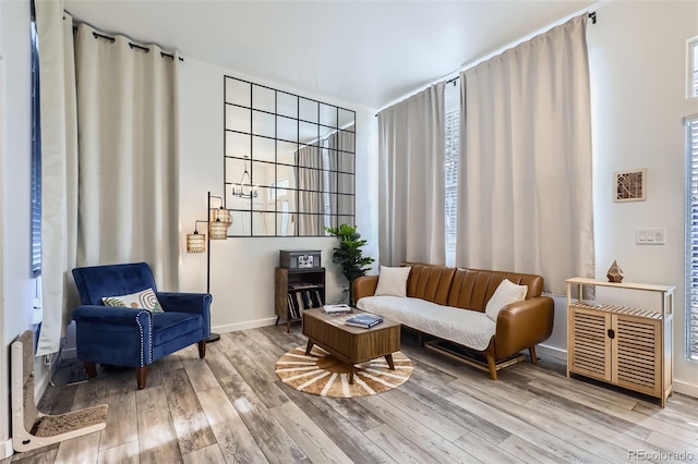 sitting room featuring wood finished floors and baseboards