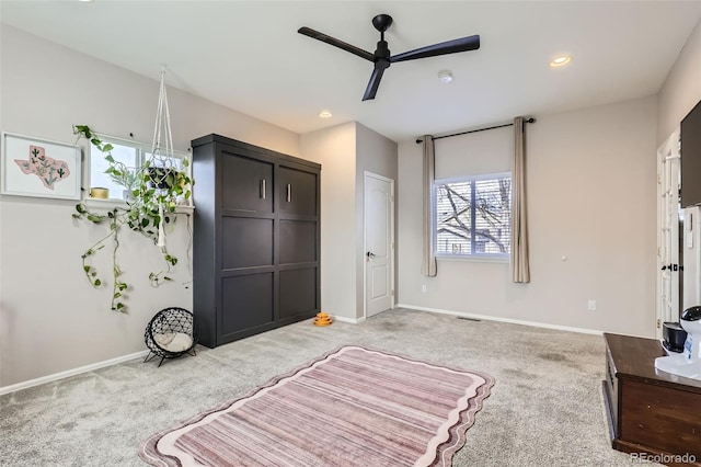 bedroom featuring recessed lighting, baseboards, light colored carpet, and a ceiling fan