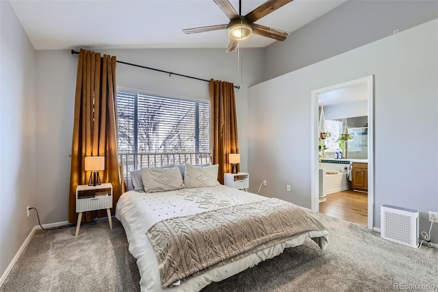 bedroom featuring light colored carpet, lofted ceiling, and multiple windows