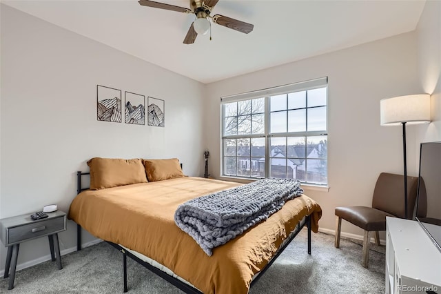 bedroom with baseboards, carpet, and a ceiling fan