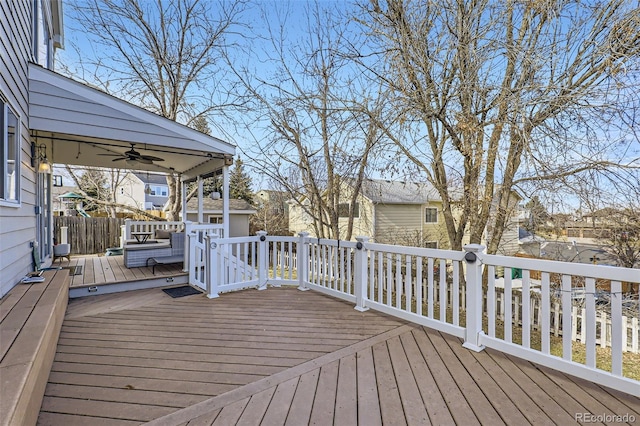 wooden deck featuring ceiling fan