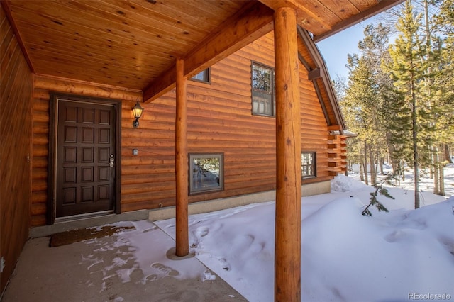 view of snow covered property entrance