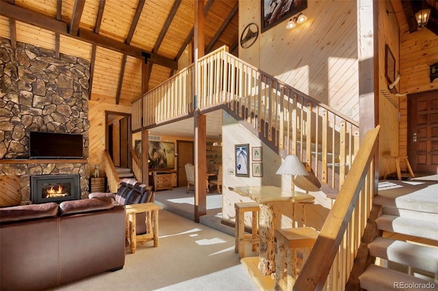 carpeted living room featuring a fireplace, high vaulted ceiling, wooden ceiling, and beamed ceiling