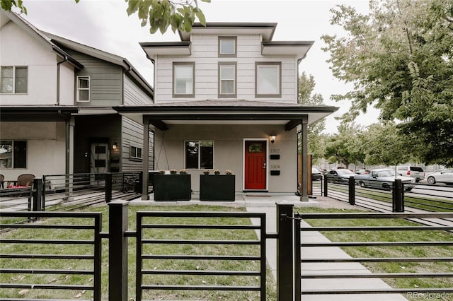 view of front of property with a front lawn and covered porch