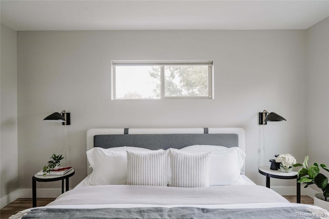 bedroom with hardwood / wood-style flooring