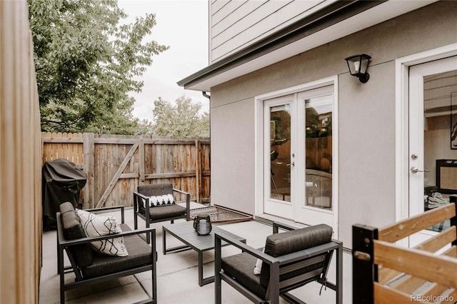 view of patio / terrace with outdoor lounge area, french doors, and a grill