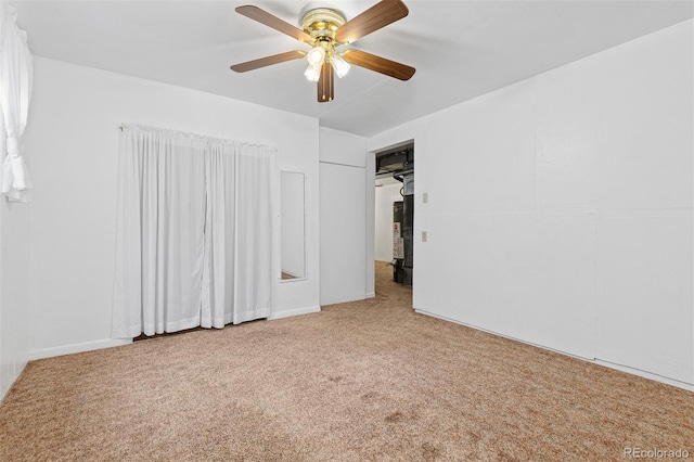 unfurnished bedroom featuring carpet floors and a ceiling fan