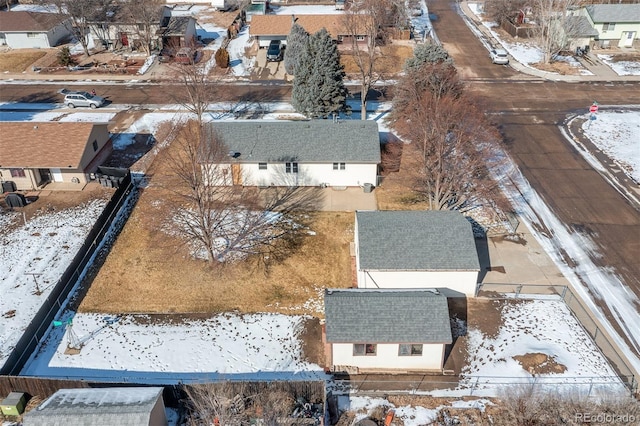 snowy aerial view featuring a residential view