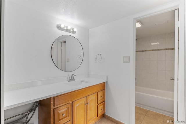 bathroom with bathtub / shower combination, tile patterned flooring, and vanity