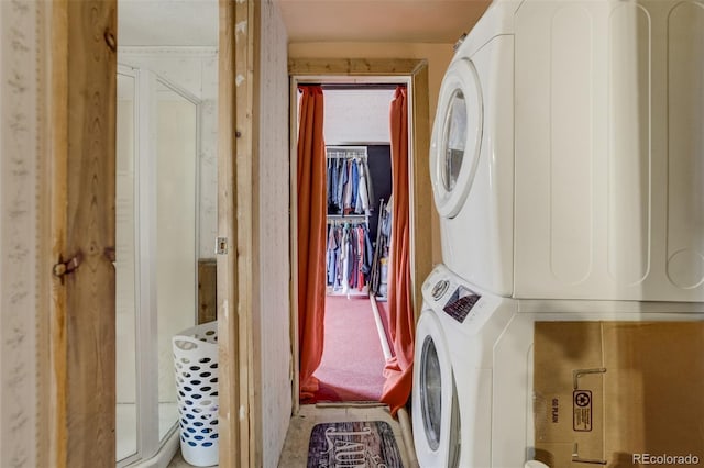 41215 Alta Vista Rd, Ramah, CO 80832 - laundry room featuring stacked washer and dryer and laundry area