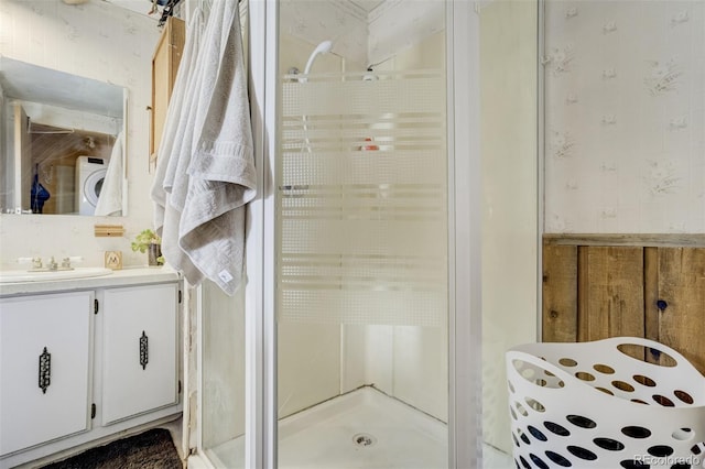 41215 Alta Vista Rd, Ramah, CO 80832 - bathroom featuring washer / dryer, vanity, wallpapered walls, and a stall shower